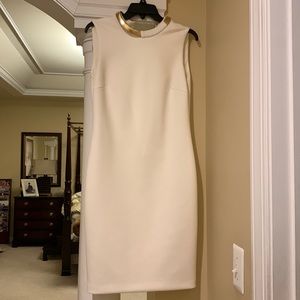 Calvin Klein white dress with build on necklace .
